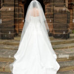 Bride Facing Away From Camera To Show Off The Back Of Her Wedding Stock